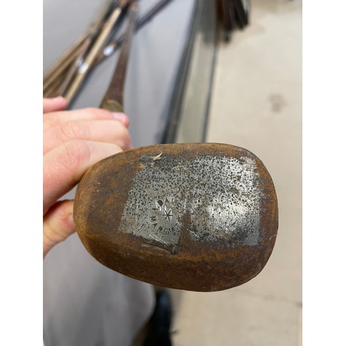 862 - 7 Antique wooden-shafted golf clubs