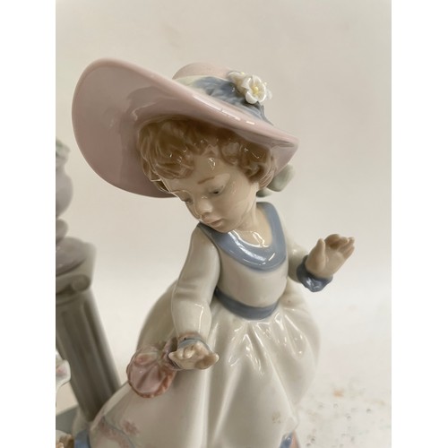 307 - A Lladro porcelain figural group, A Stitch In Time, model no. 5344, height 24cm