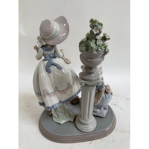 307 - A Lladro porcelain figural group, A Stitch In Time, model no. 5344, height 24cm