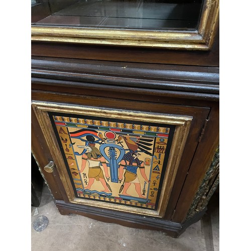 2004 - An Egyptian Revival design display cabinet, with a single-glazed and panelled cupboard door, and all... 