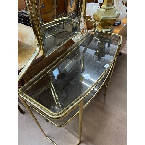 2294 - A Hollywood Regency style mirror-back console/dressing table, with 2 smoked glass shelves, W101cm, H... 