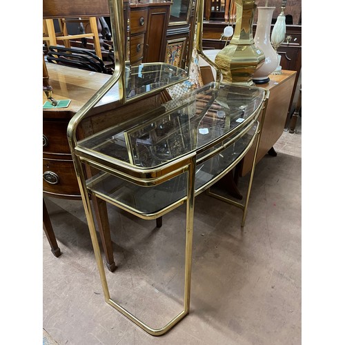 2294 - A Hollywood Regency style mirror-back console/dressing table, with 2 smoked glass shelves, W101cm, H... 