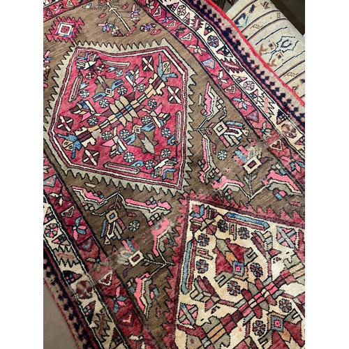 2391 - A red ground Karajeh runner, 305cm x 100cm