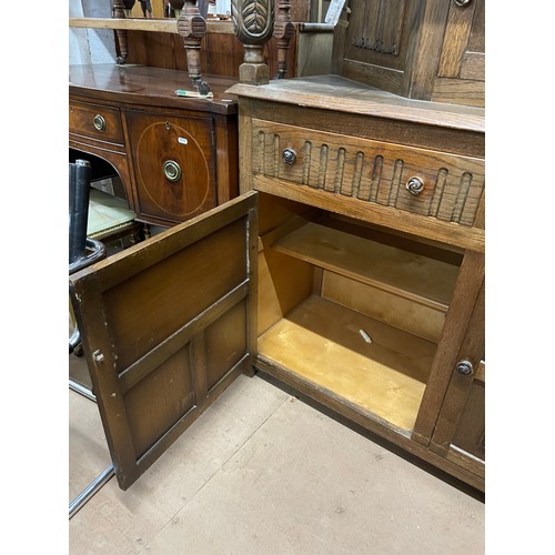 2205 - A linenfold carved and panelled oak Court cupboard, W125cm, H131cm, D48cm