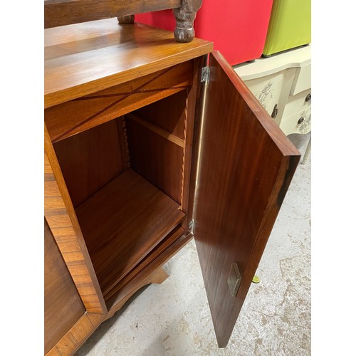 2523 - An Art Deco walnut serpentine-front 4-door sideboard, L200cm, H102cm, D49cm