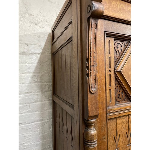 2011 - A Victorian Arts and Crafts hall cupboard, with a single carved and panelled door, W60cm, H192cm, D6... 