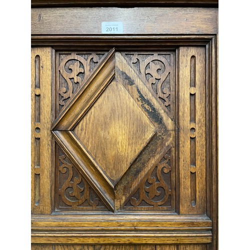 2011 - A Victorian Arts and Crafts hall cupboard, with a single carved and panelled door, W60cm, H192cm, D6... 