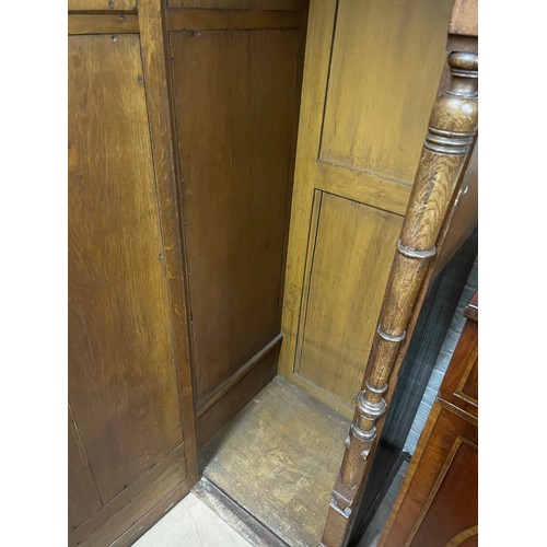 2011 - A Victorian Arts and Crafts hall cupboard, with a single carved and panelled door, W60cm, H192cm, D6... 