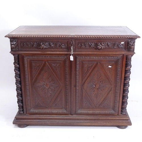 2008 - A carved oak hall cupboard, with 2 frieze drawers and spiral turned columns, W125cm, H100cm, D58cm, ... 