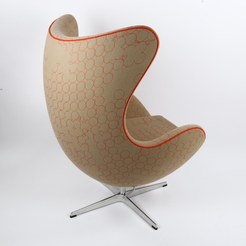 1509 - ARNE JACOBSEN an Egg chair by Fritz Hansen with  tilt and swivel action, 2015 limited edition uphols... 