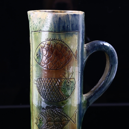 1517 - A mid-century Continental studio pottery lemonade set with sgraffito fish decoration, jug height 31c... 