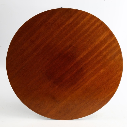 1580 - A mid-century teak top tripod table with ebonised legs, height 41cm