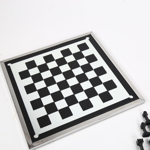 1614 - A 1960s' modernist chess set by ALCAN, France, aluminium pieces with aluminium framed mirror board, ... 