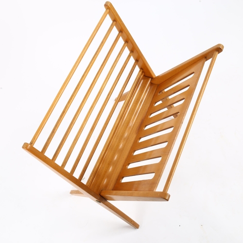 1620 - A mid-century folding, beech framed, magazine rack, height 51cm.