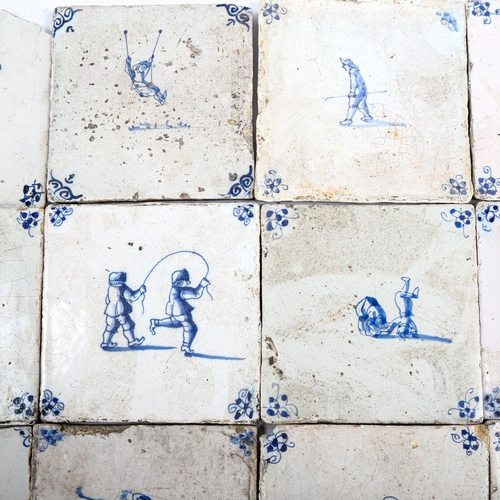 1029 - 14 Dutch Delft blue and white tiles, late 18th/early 19th century, comprising figures participating ... 