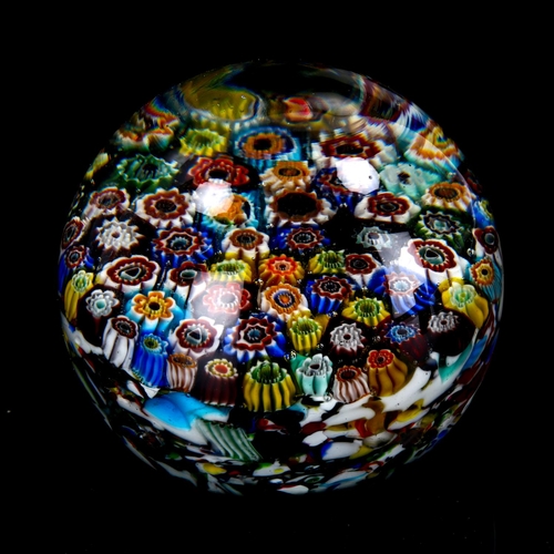 1034 - A large Millefiori glass paperweight, diameter 9cm