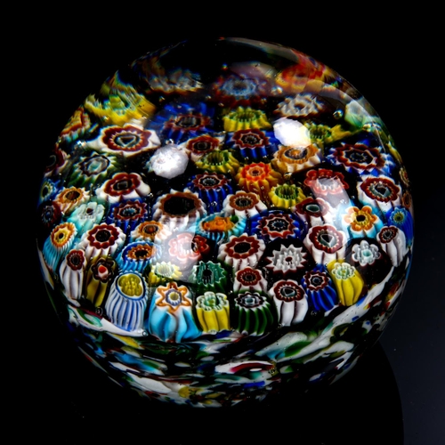 1034 - A large Millefiori glass paperweight, diameter 9cm