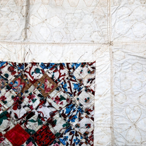 1040 - A Victorian patchwork quilt, hand stitched glazed cotton printed squares, approx 122cm x 103cm