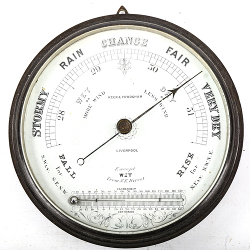 1054 - A Victorian Keen & Frodsham combination barometer / thermometer, in original metal case with bevelle... 