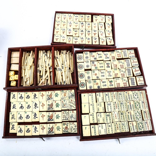 1060 - A Chinese bone and bamboo Mahjong set, early 20th century, in hardwood and nickel-mounted carrying c... 