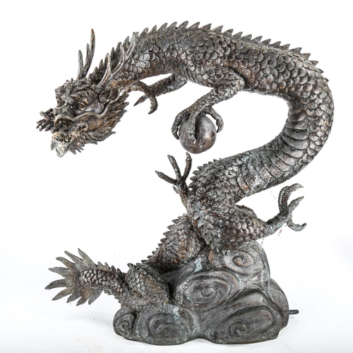 1061 - A Chinese grey patinated bronze dragon design water feature, height 59cm