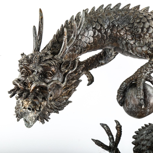 1061 - A Chinese grey patinated bronze dragon design water feature, height 59cm