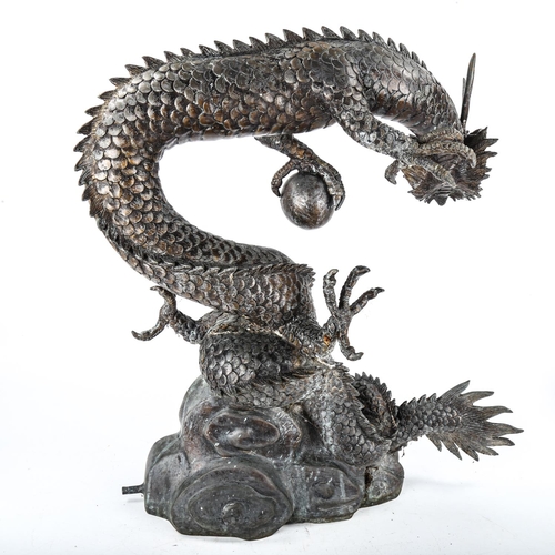 1061 - A Chinese grey patinated bronze dragon design water feature, height 59cm