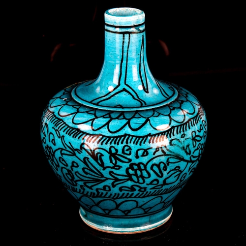 1074 - A Middle Eastern Iznik turquoise glaze ceramic narrow-neck vase, with hand painted decoration, heigh... 