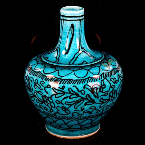 1074 - A Middle Eastern Iznik turquoise glaze ceramic narrow-neck vase, with hand painted decoration, heigh... 