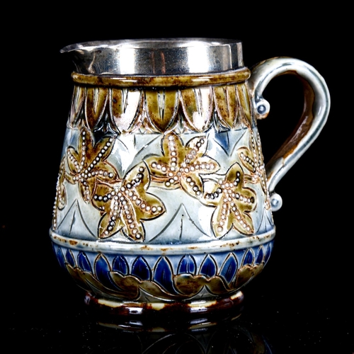 1091 - Francis E Lee for Doulton Lambeth, a small stoneware cream jug, with incised decoration and silver r... 