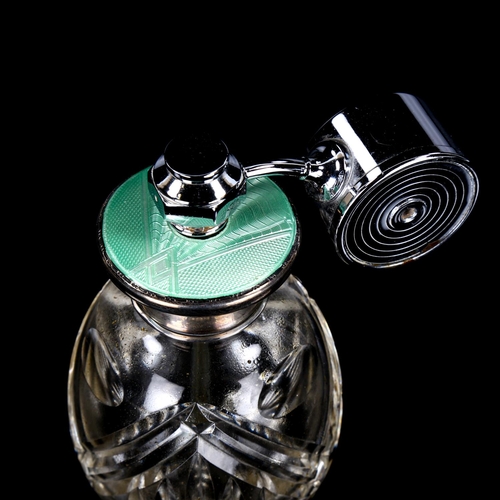 1105 - A cut-glass silver and green enamel atomiser perfume bottle with chrome plate attachment, height 11.... 