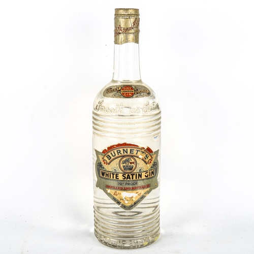 1120 - A mid 1950s' bottle of Burnett's White Satin Gin, with spring top fastening, 70% proof.