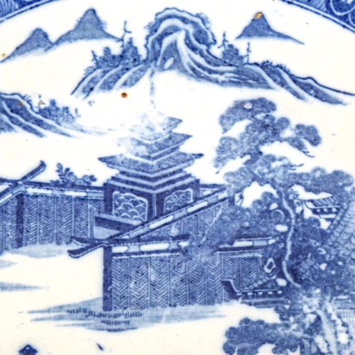 1141 - A Chinese blue and white transfer decorated charger, diameter 36cm