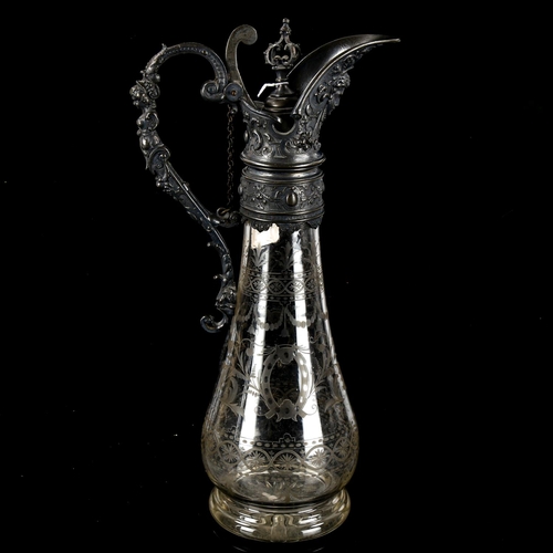 1148 - An ornate 19th century etched glass Claret jug, with cast pewter mount, height 36cm