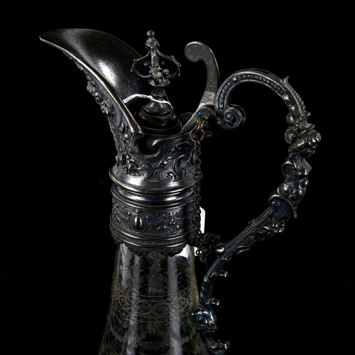 1148 - An ornate 19th century etched glass Claret jug, with cast pewter mount, height 36cm