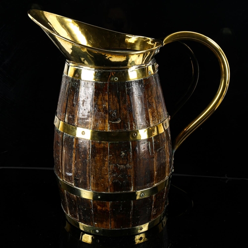 1160 - A large brass and wood coopered barrel design jug, height 43cm