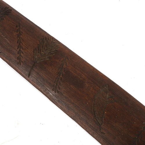 1163 - An African Tribal hardwood club, with carved geometric designs, probably early to mid-20th century, ... 