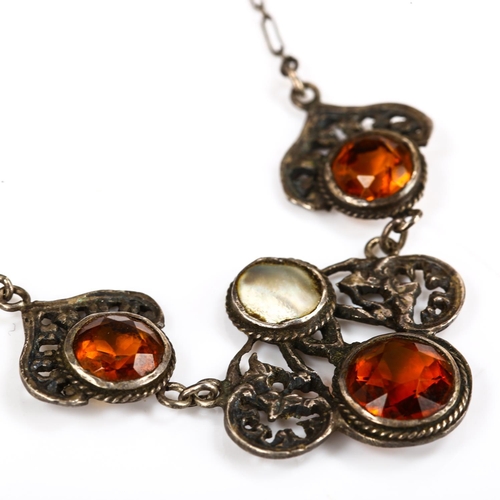 255 - A Continental Arts and Crafts unmarked silver citrine and blister pearl necklace, pierced floral des... 