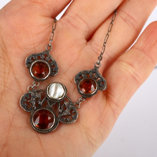 255 - A Continental Arts and Crafts unmarked silver citrine and blister pearl necklace, pierced floral des... 