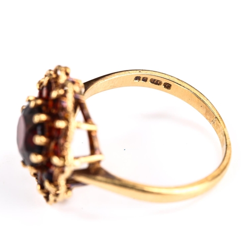 261 - A late 20th century 9ct gold garnet cluster flowerhead ring, set with round-cut garnets, hallmarks L... 