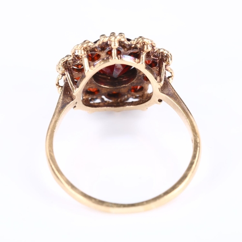 261 - A late 20th century 9ct gold garnet cluster flowerhead ring, set with round-cut garnets, hallmarks L... 