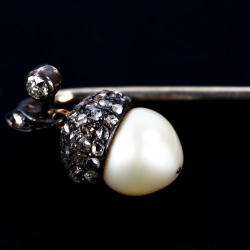 101 - An early 20th century rose-cut diamond and pearl acorn stickpin, unmarked white metal settings with ... 