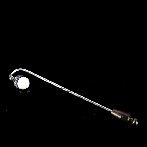 101 - An early 20th century rose-cut diamond and pearl acorn stickpin, unmarked white metal settings with ... 