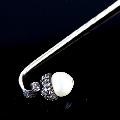 101 - An early 20th century rose-cut diamond and pearl acorn stickpin, unmarked white metal settings with ... 