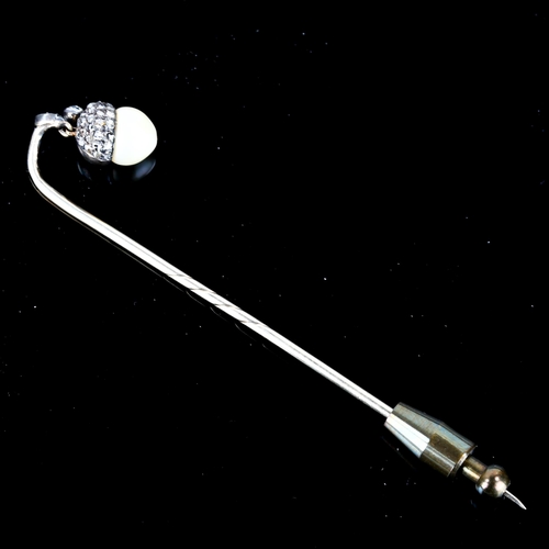 101 - An early 20th century rose-cut diamond and pearl acorn stickpin, unmarked white metal settings with ... 