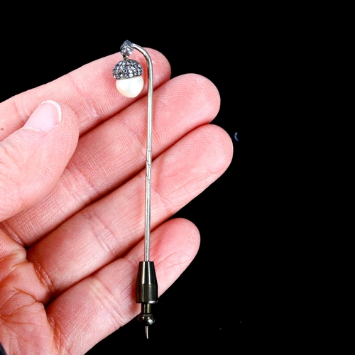 101 - An early 20th century rose-cut diamond and pearl acorn stickpin, unmarked white metal settings with ... 