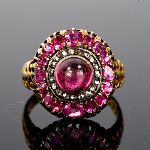 106 - An Antique ruby and diamond cluster ring, unmarked gold settings, set with central high cabochon rub... 