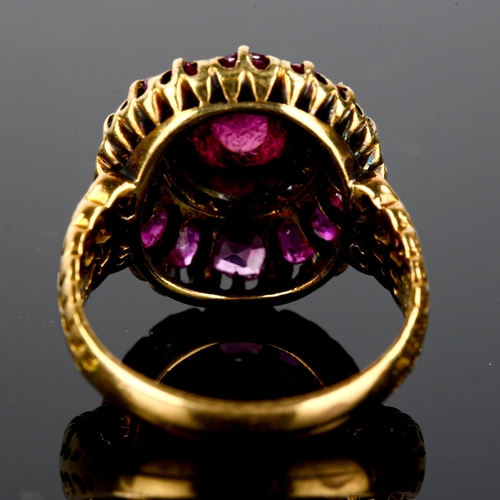 106 - An Antique ruby and diamond cluster ring, unmarked gold settings, set with central high cabochon rub... 