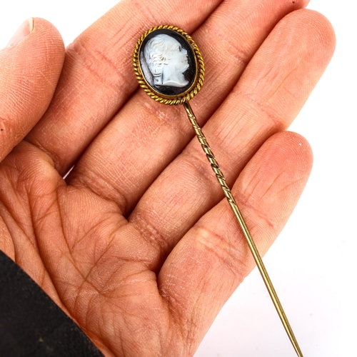 110 - An Antique hardstone cameo stickpin, unmarked gold settings, with relief carved male head profile, s... 