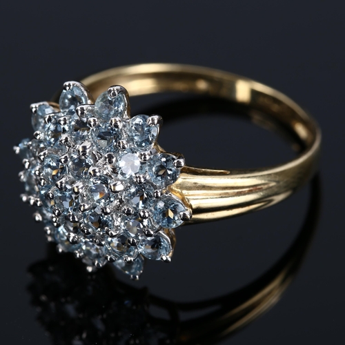 420 - A modern 9ct gold blue topaz cluster dress ring, setting height 17.1mm, size V, 3.6g